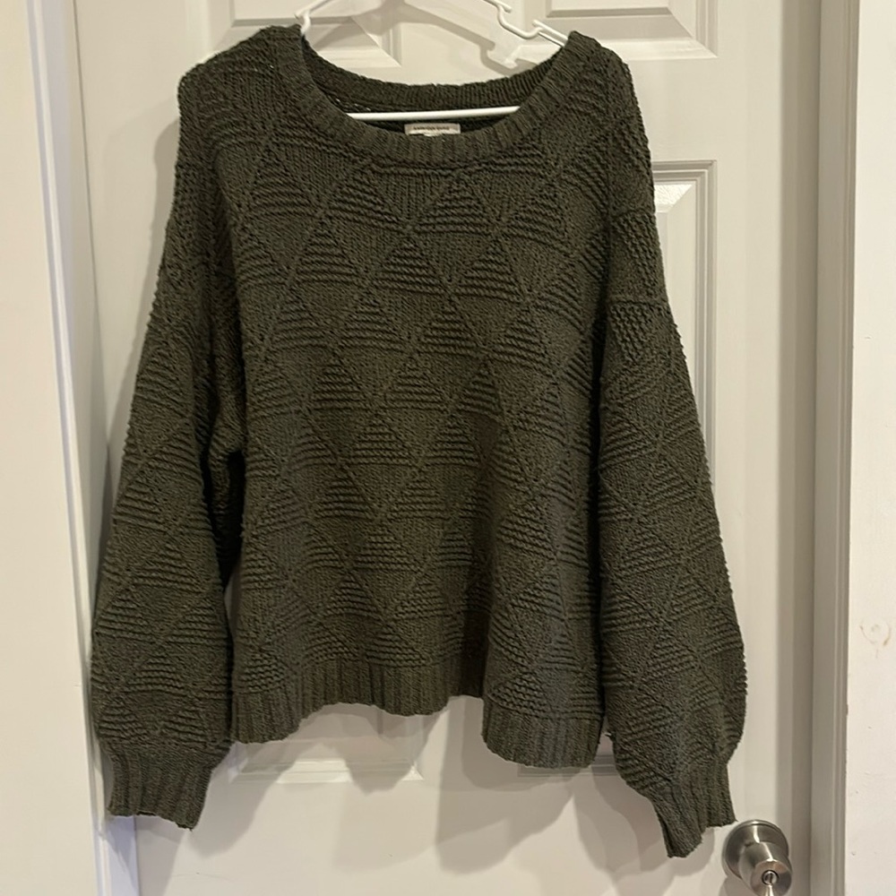 Green, patterned sweater
